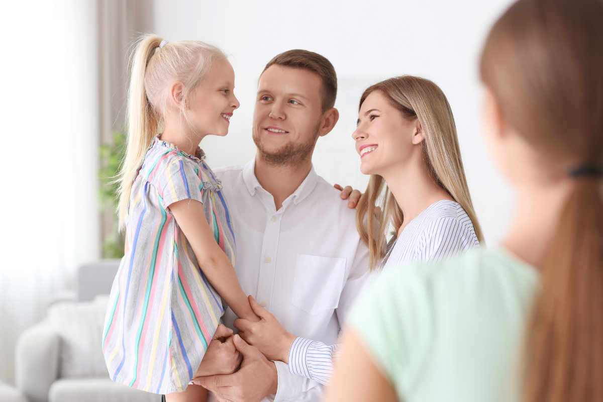 Parents and babysitter with child
